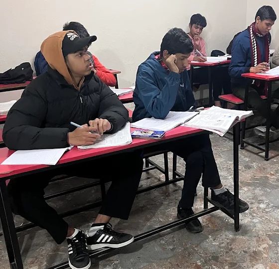 Students working through practice questions at their desks