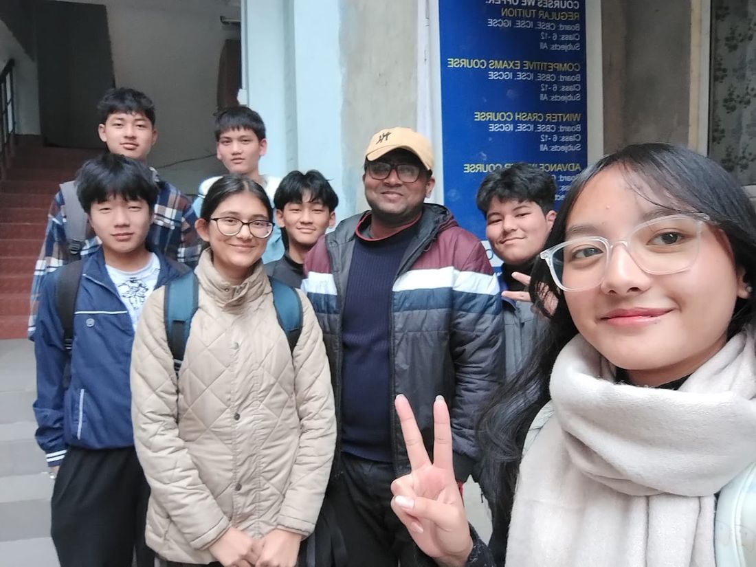 Ascend Institute students and tutor outside the institute